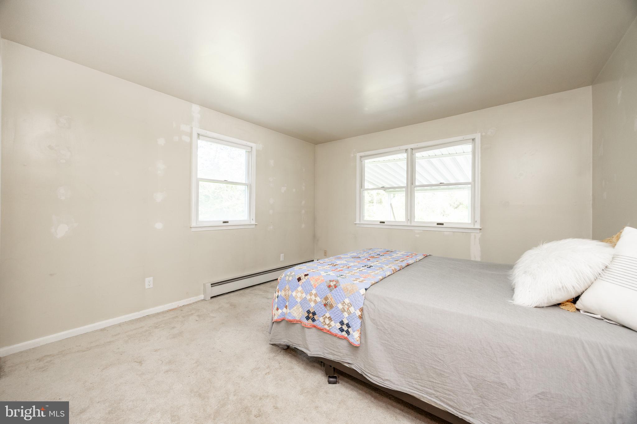 5509 Hoppenville Road Green Lane, PA 18054 - Photo 13 of 70 a bedroom with a bed and a window