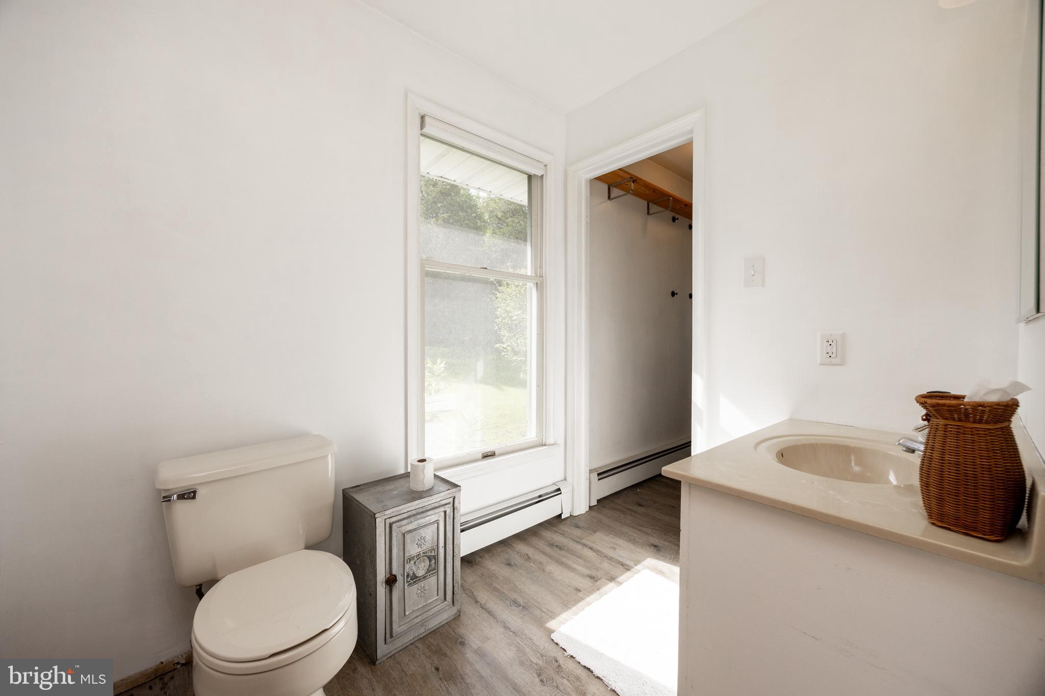 5509 Hoppenville Road Green Lane, PA 18054 - Photo 15 of 70 a white toilet sitting next to a bathroom sink