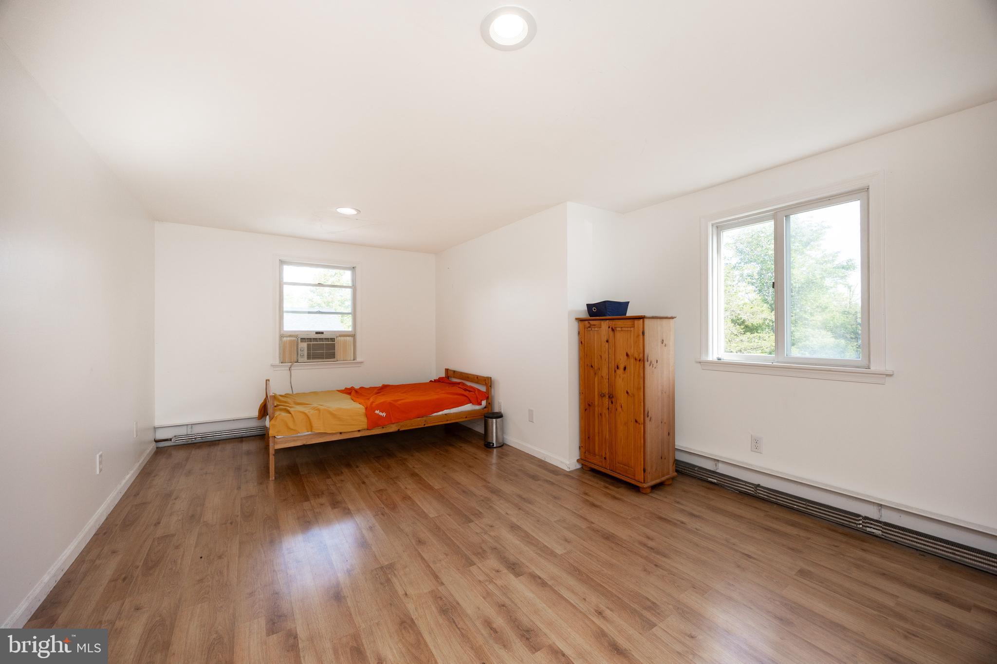 5509 Hoppenville Road Green Lane, PA 18054 - Photo 17 of 70 a room with wooden floor and window