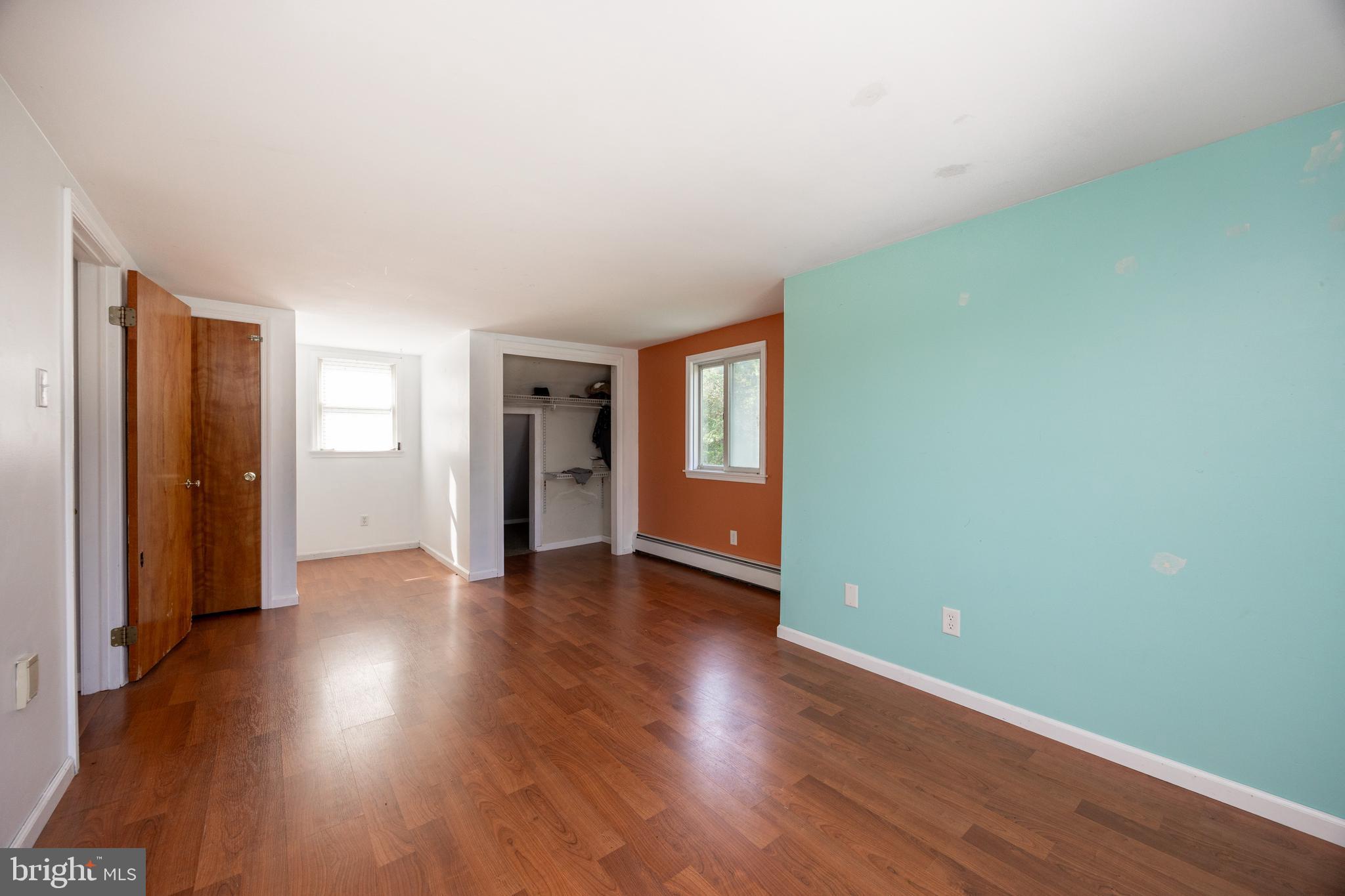 5509 Hoppenville Road Green Lane, PA 18054 - Photo 21 of 70 a view of an empty room with window and wooden floor