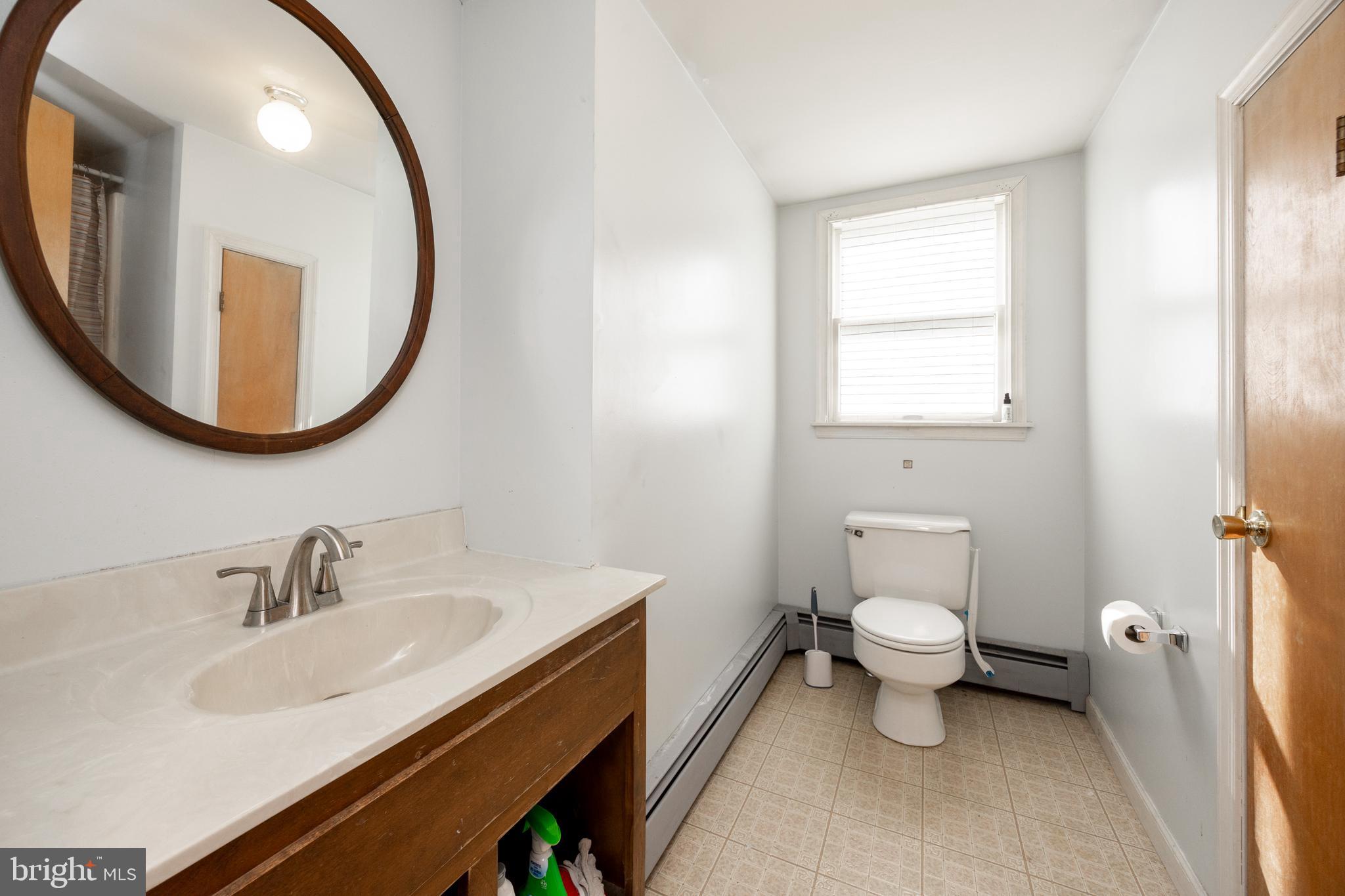 5509 Hoppenville Road Green Lane, PA 18054 - Photo 22 of 70 a bathroom with a sink and a mirror