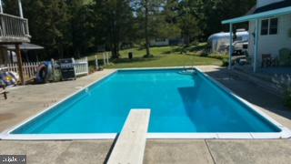 5509 Hoppenville Road Green Lane, PA 18054 - Photo 27 of 70 a view of a swimming pool with a patio and a yard