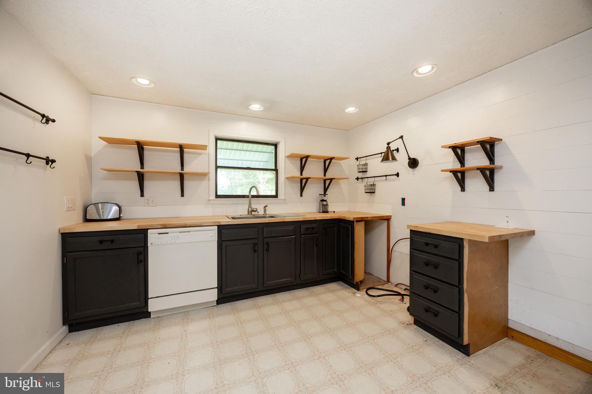 5509 Hoppenville Road Green Lane, PA 18054 - Photo 39 of 70 a kitchen with a sink stove and cabinets