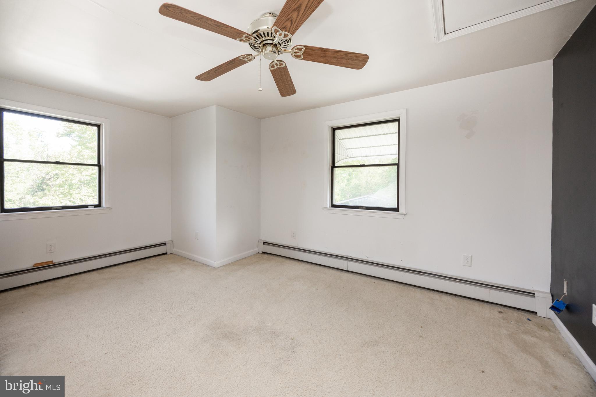 5509 Hoppenville Road Green Lane, PA 18054 - Photo 46 of 70 an empty room with windows and fan