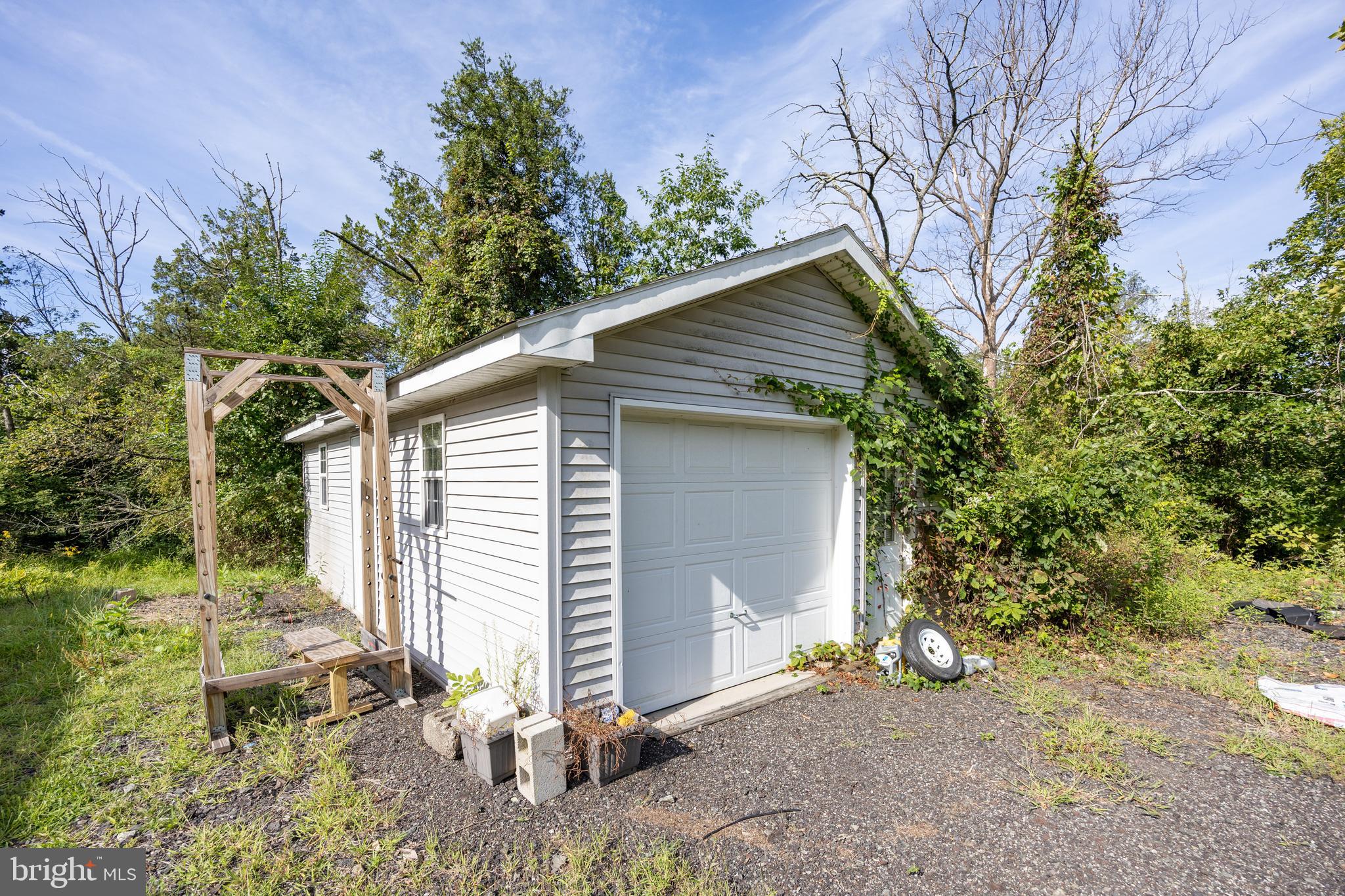 5509 Hoppenville Road Green Lane, PA 18054 - Photo 51 of 70 a backyard of a house with table and chairs