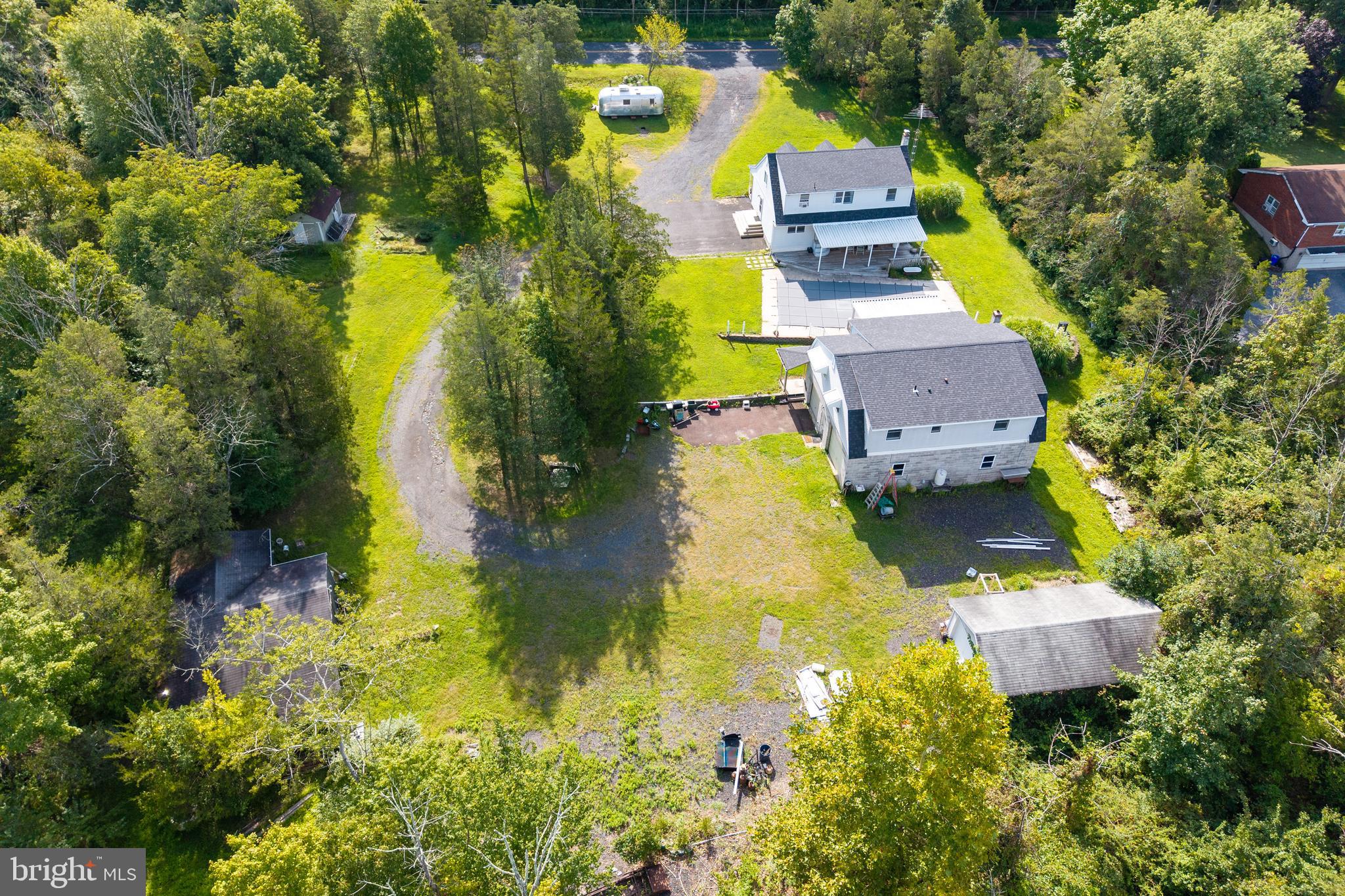 5509 Hoppenville Road Green Lane, PA 18054 - Photo 54 of 70 an aerial view of a house with swimming pool