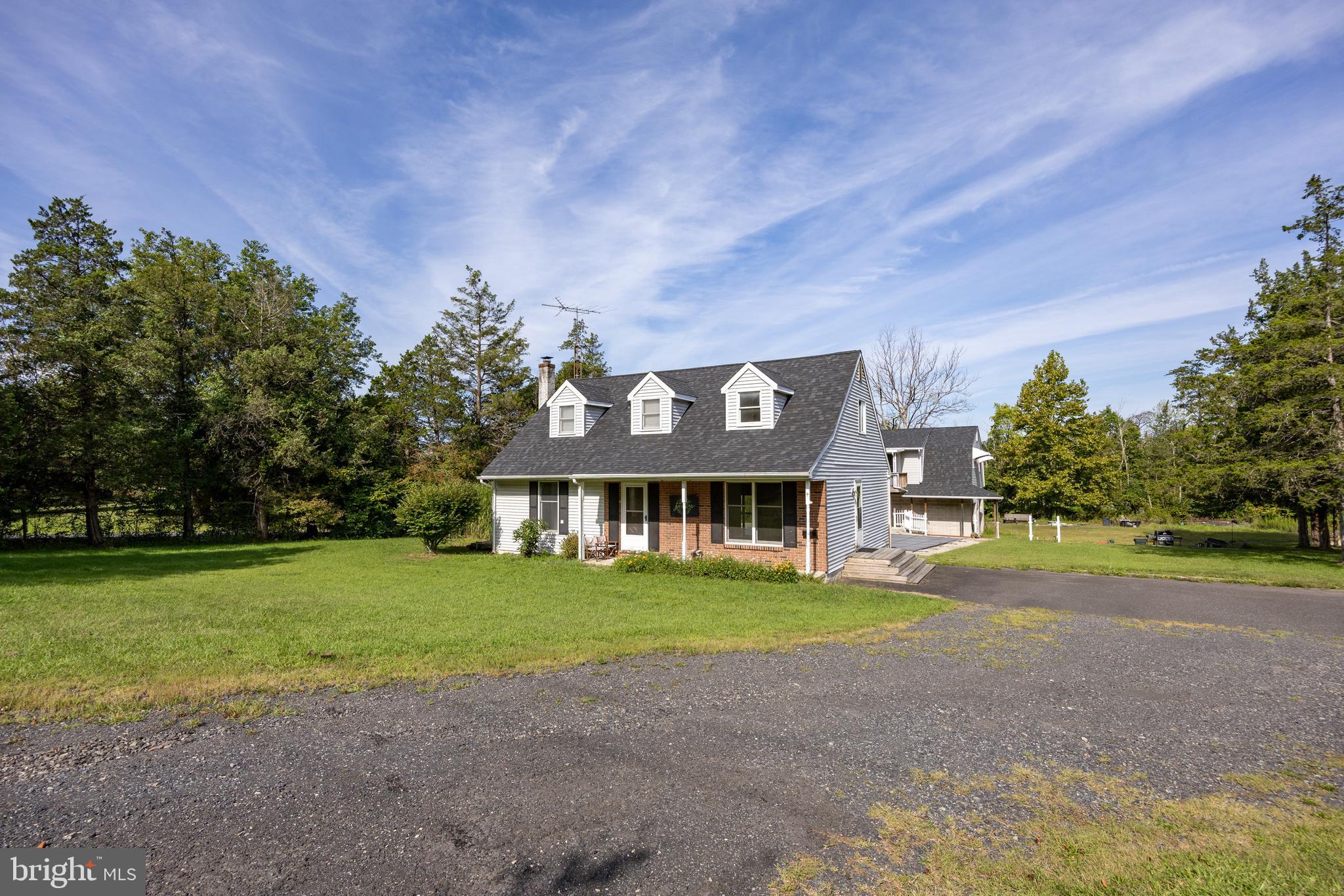 5509 Hoppenville Road Green Lane, PA 18054 - Photo 64 of 70 a front view of a house with a yard and trees
