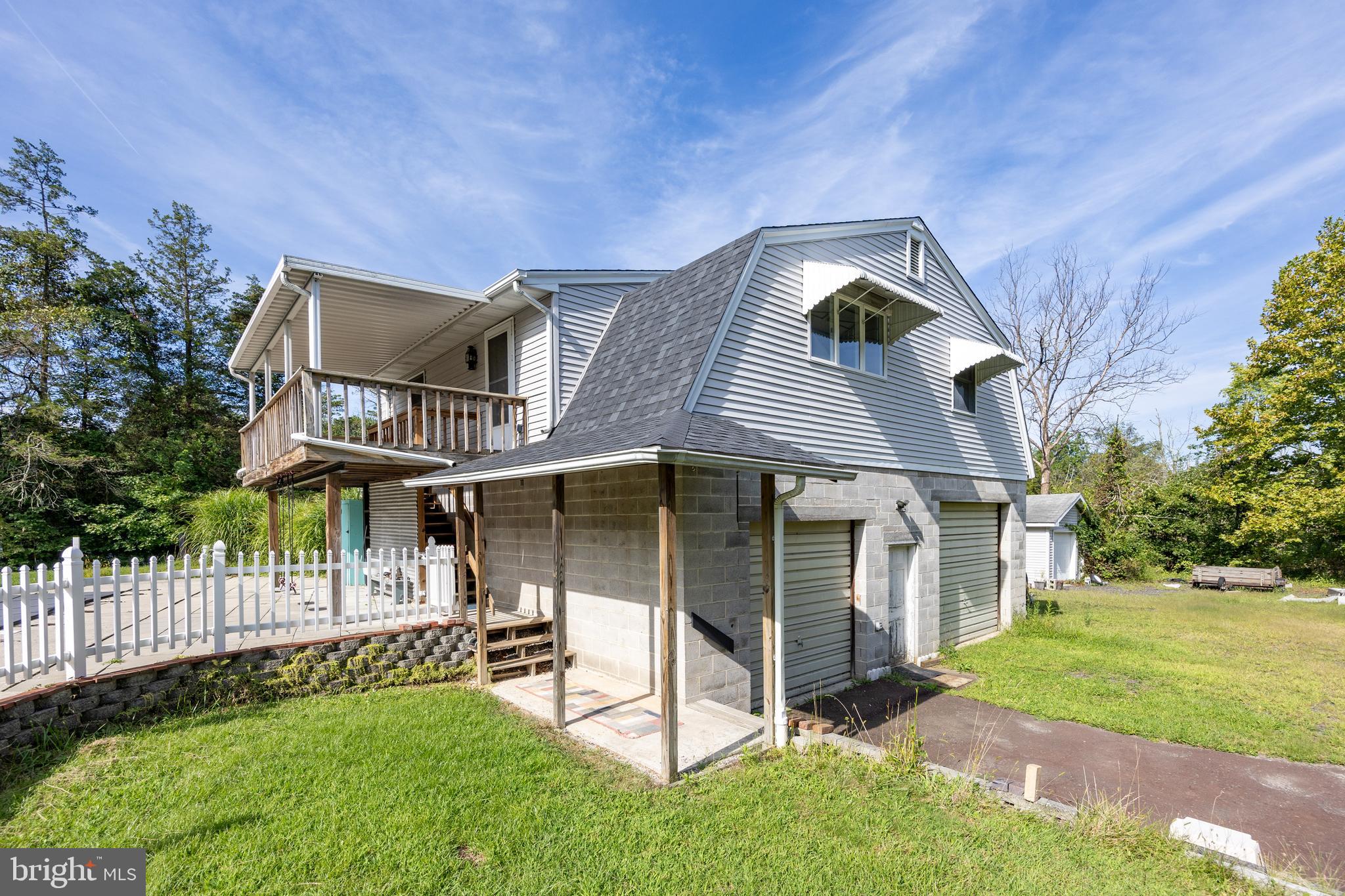 5509 Hoppenville Road Green Lane, PA 18054 - Photo 65 of 70 a view of a house with a yard and wooden fence