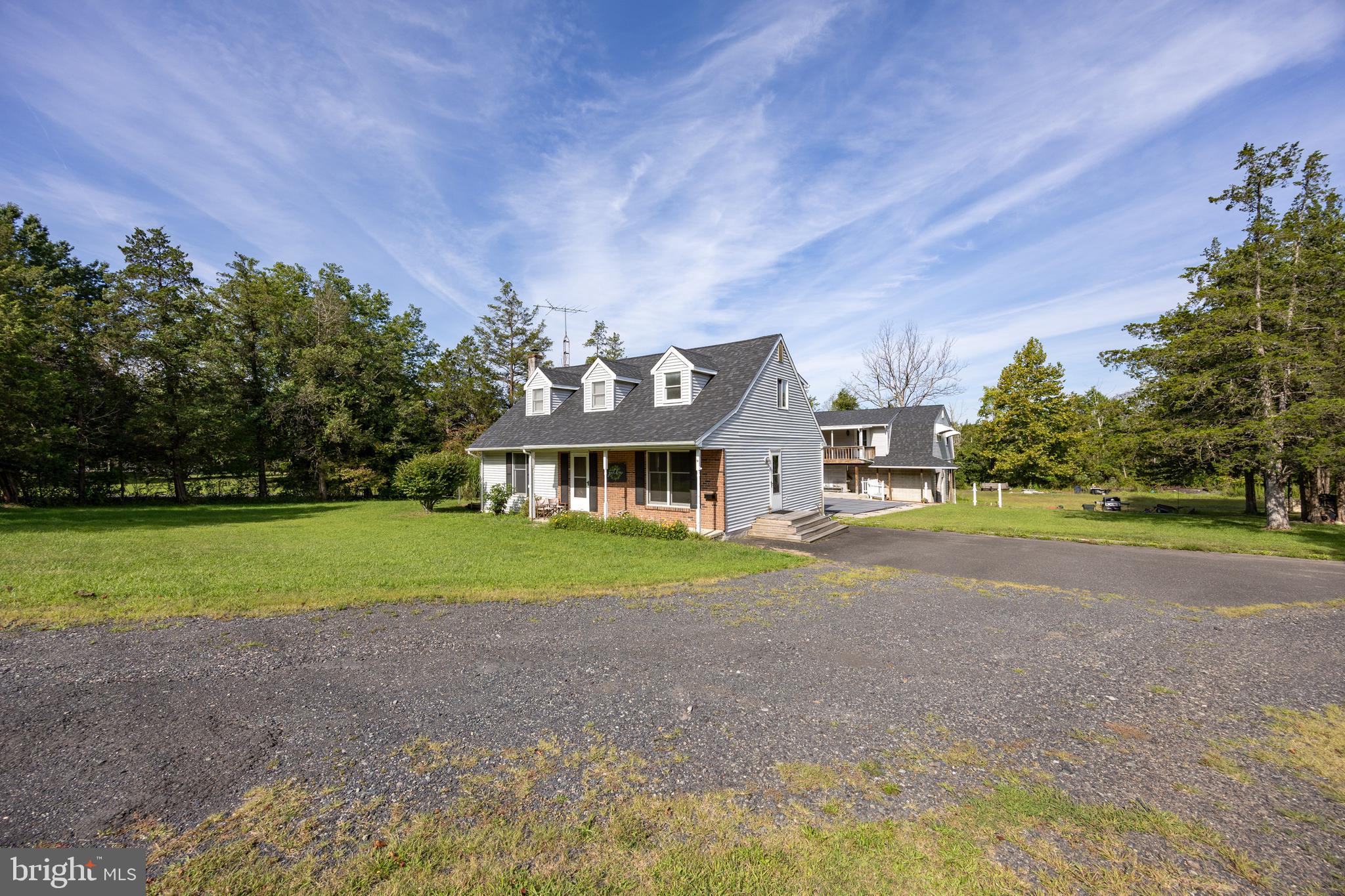 5509 Hoppenville Road Green Lane, PA 18054 - Photo 70 of 70 a front view of a house with a yard and garage