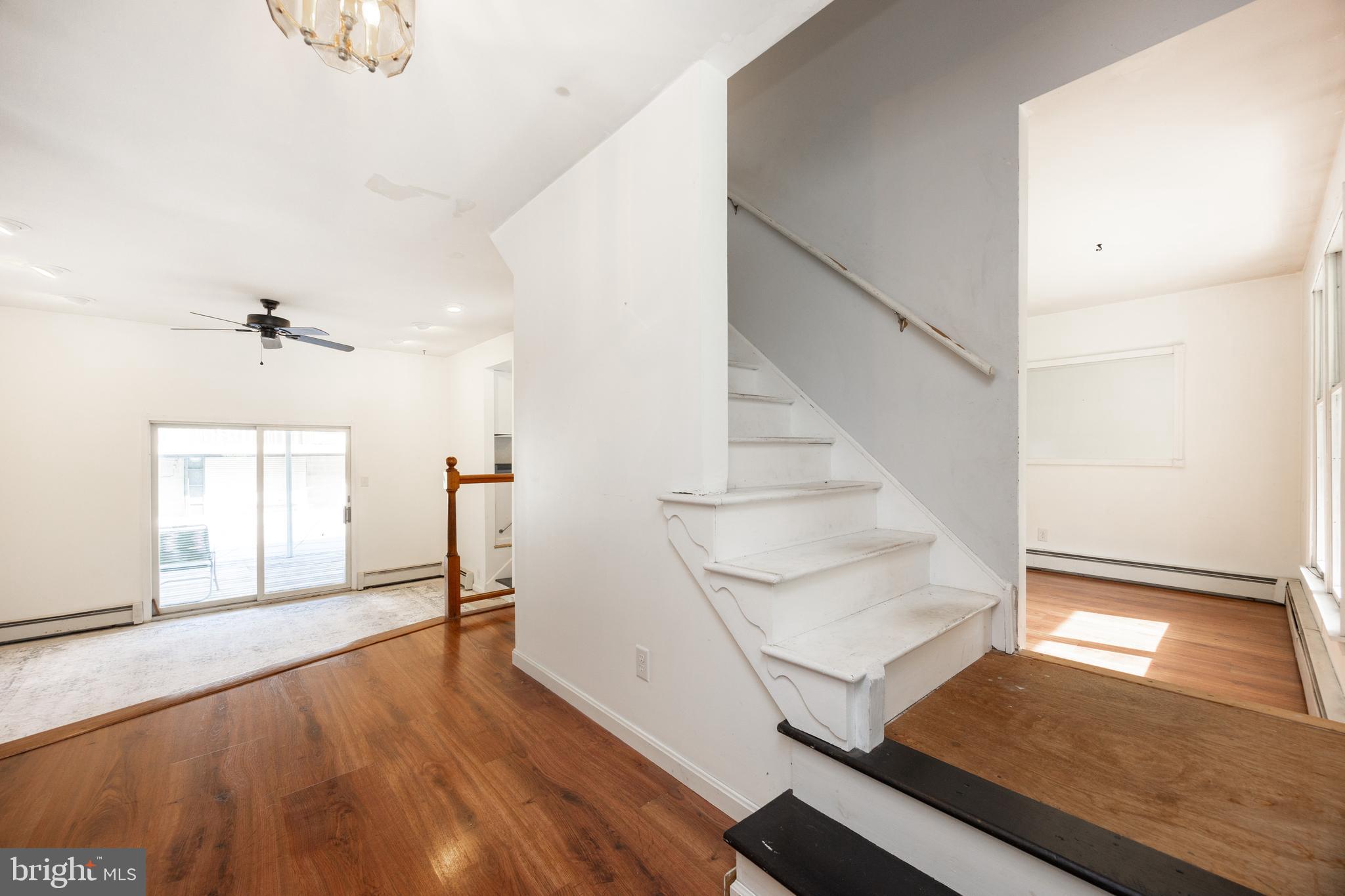 5509 Hoppenville Road Green Lane, PA 18054 - Photo 9 of 70 a view of a living room with wooden floor and paintings on the wall