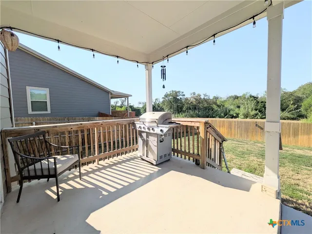 a balcony with wooden floor