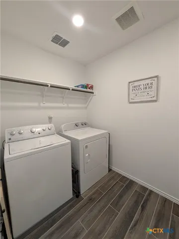 a utility room with dryer and washer