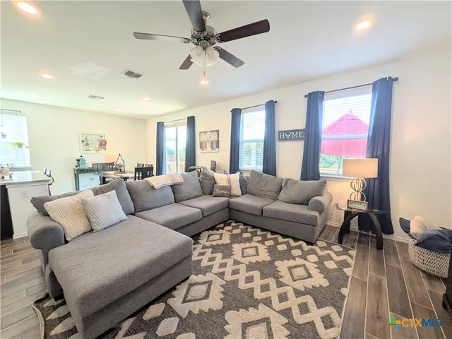 a living room with furniture and a rug