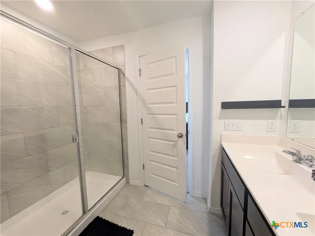 a bathroom with a sink and a shower