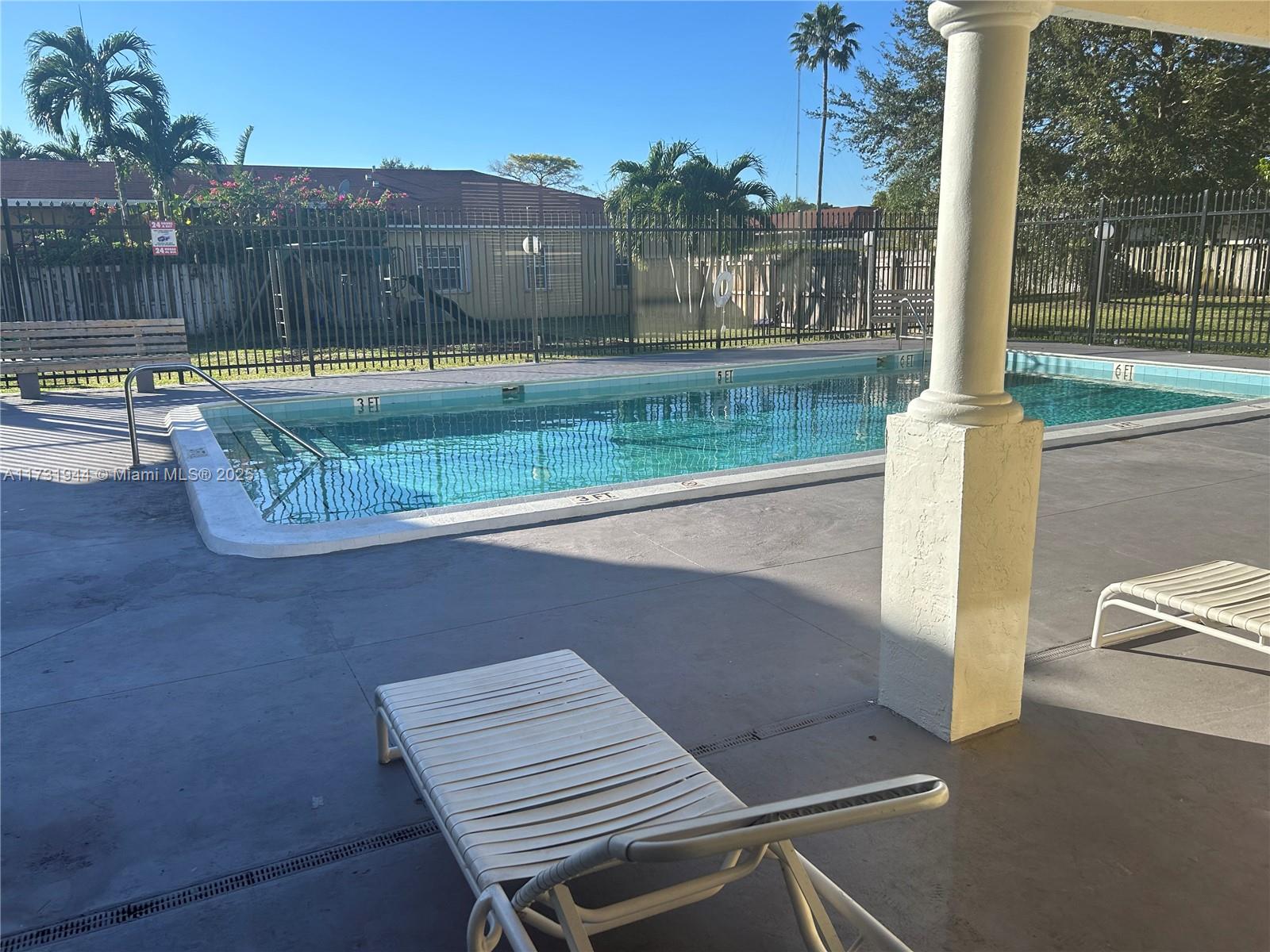 Ives Estates Miami, FL 33179 - Photo 17 of 19 a view of a patio with a table and chairs