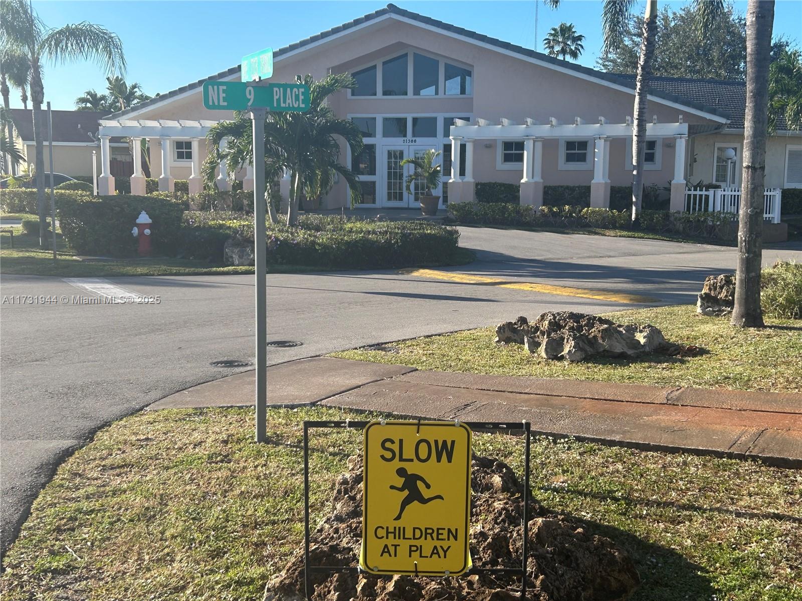 Ives Estates Miami, FL 33179 - Photo 19 of 19 a front view of a house with a yard