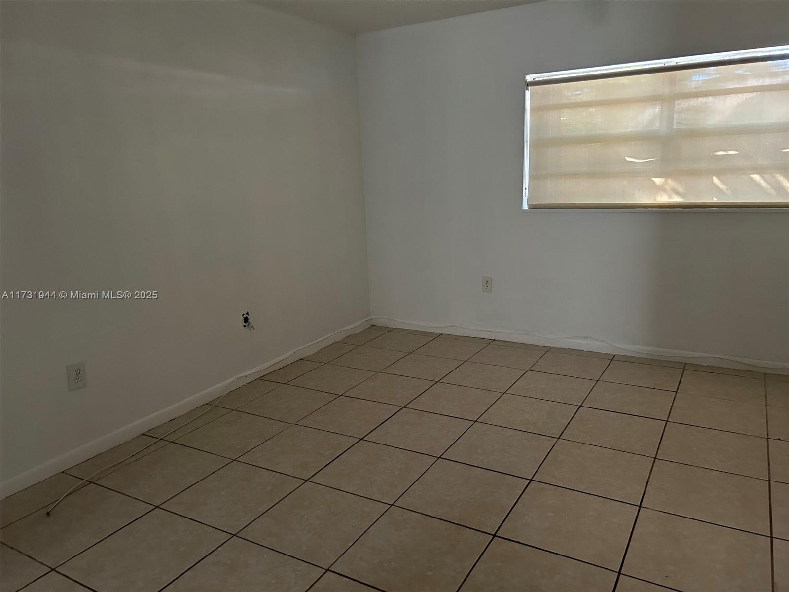 Ives Estates Miami, FL 33179 - Photo 9 of 19 a view of a room that has a window