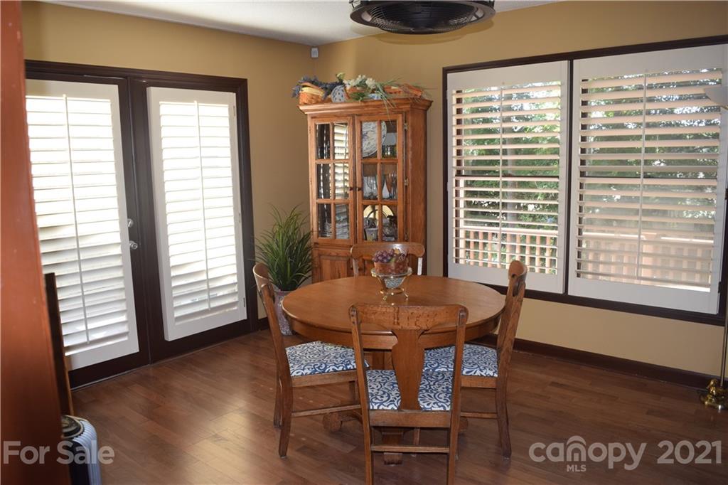 18 Shipmaster Court Lake Wylie, SC 29710 - Photo 12 of 34 a dining room with furniture and wooden floor