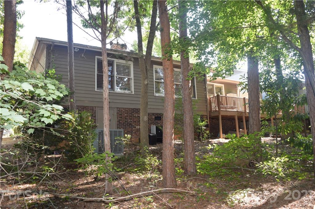 18 Shipmaster Court Lake Wylie, SC 29710 - Photo 31 of 34 a front view of a building with a garden