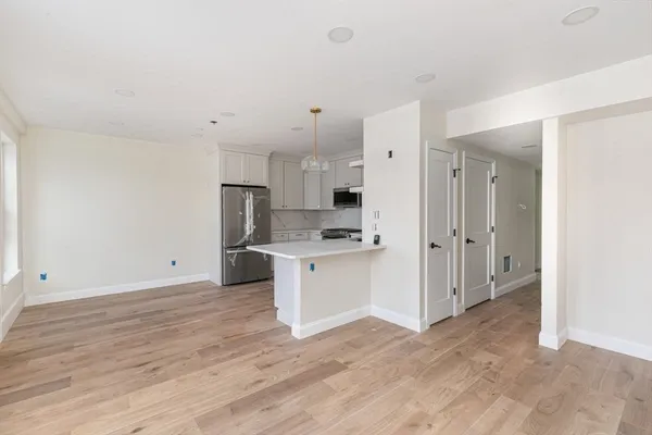 a view of kitchen with wooden floor