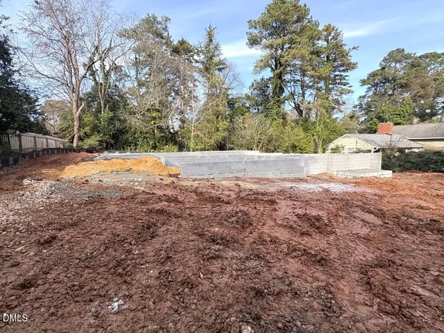 a view of a hallway with a chandelier fan