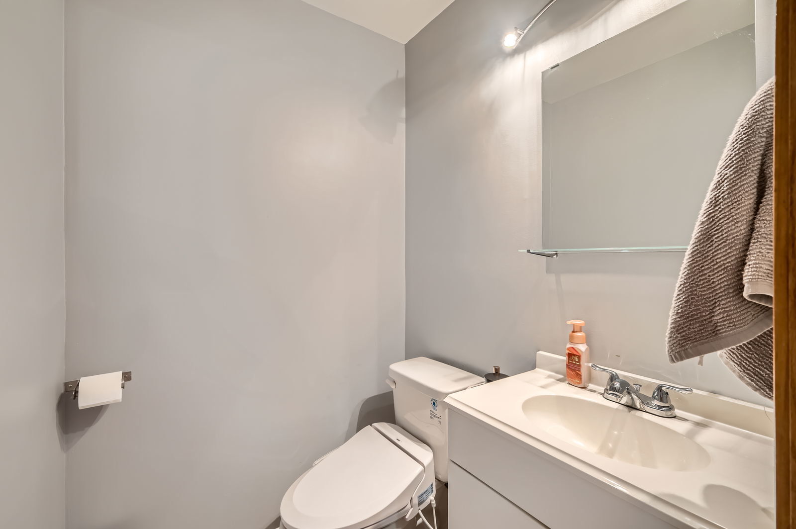 953 North Rohlwing Road, Unit 201A Addison, IL 60101 - Photo 6 of 11 a white toilet sitting next to a bathroom sink