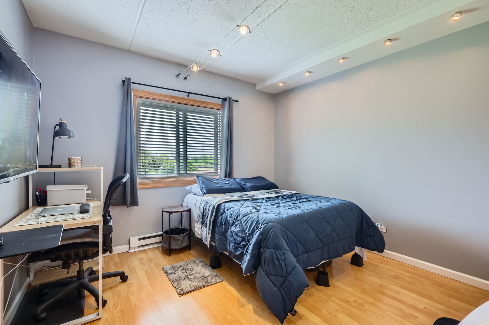 953 North Rohlwing Road, Unit 201A Addison, IL 60101 - Photo 9 of 11 a bedroom with a bed and a window