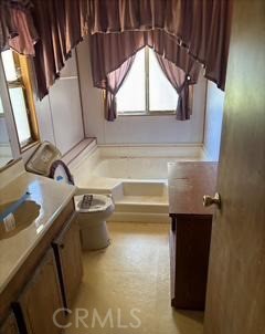 5937 Grove Street Lucerne, CA 95458 - Photo 11 of 12 a bathroom with a sink and a mirror