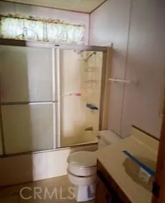 a view of a room with wooden walls