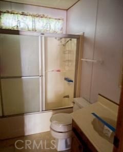 5937 Grove Street Lucerne, CA 95458 - Photo 8 of 12 a bathroom with a sink toilet and shower