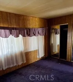 a view of an empty room with a fireplace