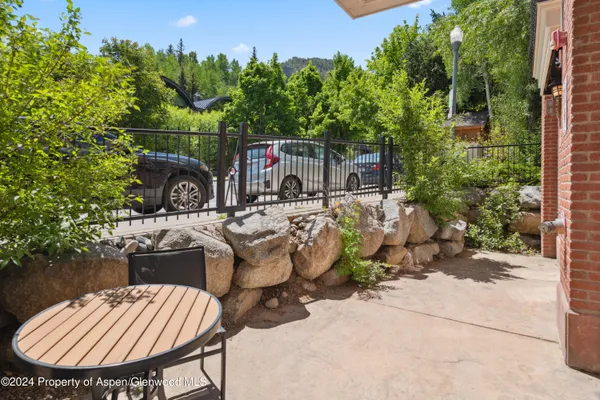 an outdoor space with patio furniture