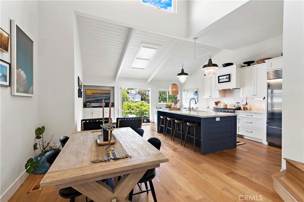 721 Browncroft Road Laguna Beach, CA 92651 - Photo 14 of 42 a view of kitchen island dining table and chairs