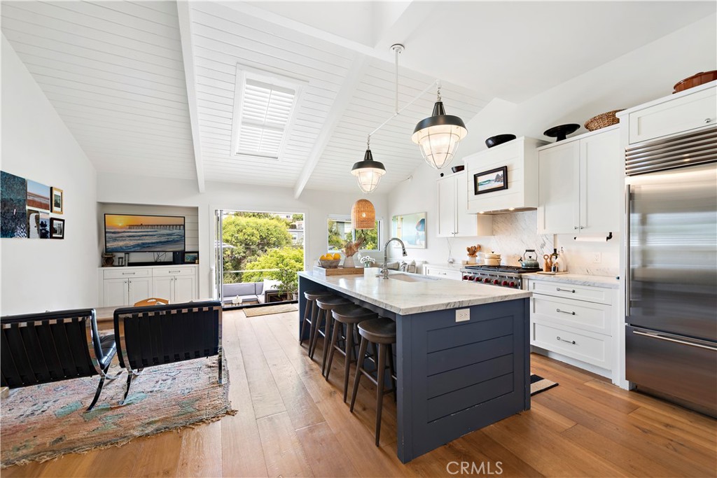 721 Browncroft Road Laguna Beach, CA 92651 - Photo 15 of 42 a kitchen with a sink refrigerator and window