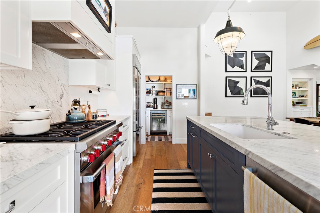 721 Browncroft Road Laguna Beach, CA 92651 - Photo 17 of 42 a kitchen with stainless steel appliances granite countertop a stove and a sink