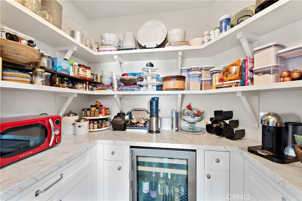 721 Browncroft Road Laguna Beach, CA 92651 - Photo 22 of 42 a kitchen with lots of counter top space and cabinets