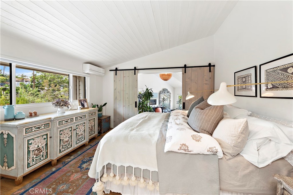 721 Browncroft Road Laguna Beach, CA 92651 - Photo 31 of 42 a bedroom with a large bed and a window