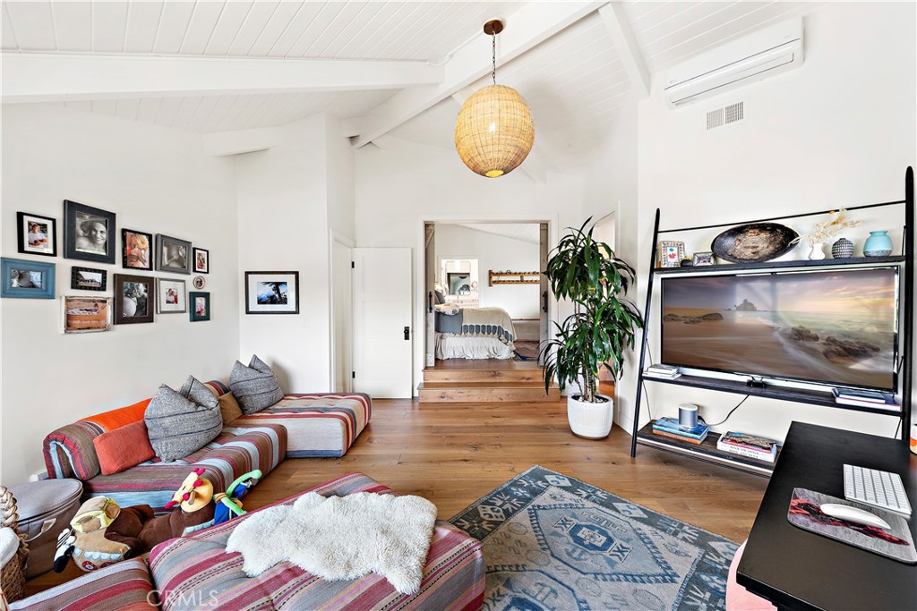 721 Browncroft Road Laguna Beach, CA 92651 - Photo 33 of 42 a living room with furniture and a flat screen tv