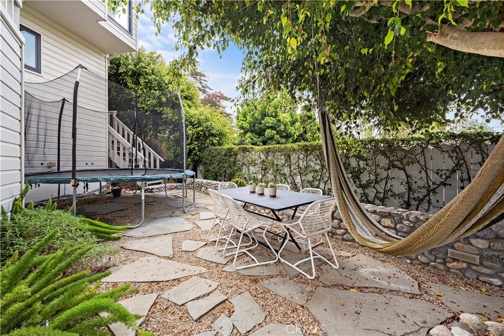 721 Browncroft Road Laguna Beach, CA 92651 - Photo 6 of 42 a view of a chairs and table in backyard