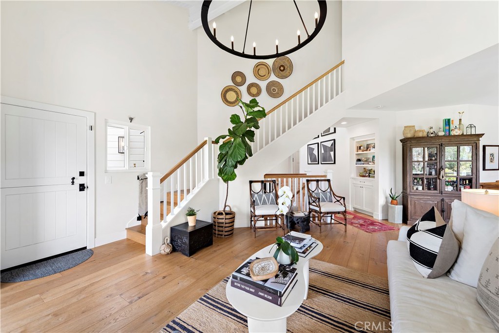 721 Browncroft Road Laguna Beach, CA 92651 - Photo 10 of 42 a living room with lots of furniture and a large mirror