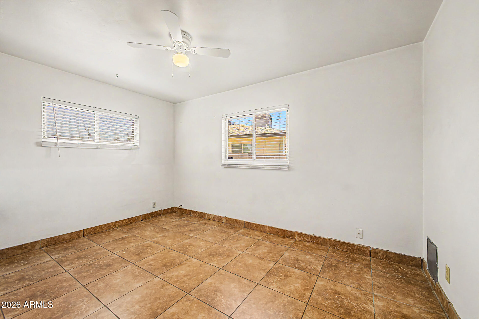 2022 East Monterey Way Phoenix, AZ 85016 - Photo 19 of 29 a view of an empty room with a window