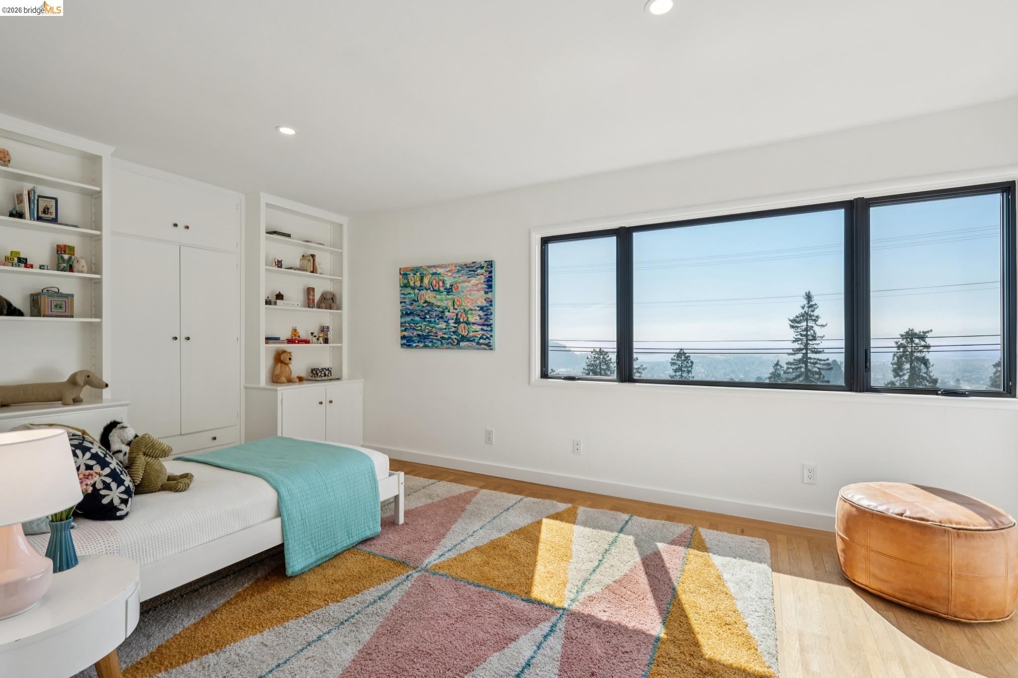 38 Highgate Road Kensington, CA 94707 - Photo 37 of 78 Recessed lighting illuminates the space, featuring built-in shelving, white cabinetry, and a large window