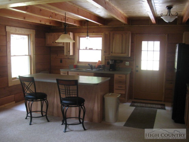 692 Mt Paron Road Deep Gap, NC 28618 - Photo 4 of 10 a kitchen with a sink cabinets and window