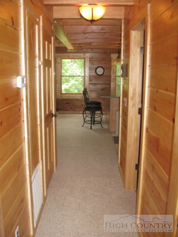 692 Mt Paron Road Deep Gap, NC 28618 - Photo 6 of 10 a view of a door and chair in a room