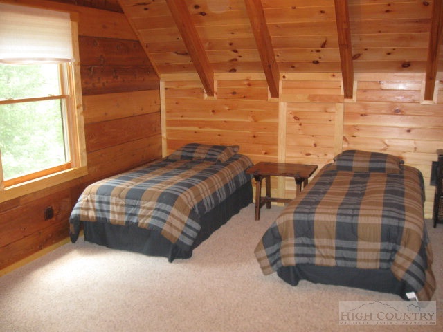 692 Mt Paron Road Deep Gap, NC 28618 - Photo 9 of 10 a bedroom with a bed and a window