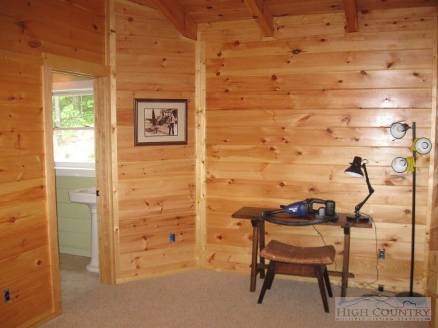 692 Mt Paron Road Deep Gap, NC 28618 - Photo 10 of 10 a view of a door and chair in the room