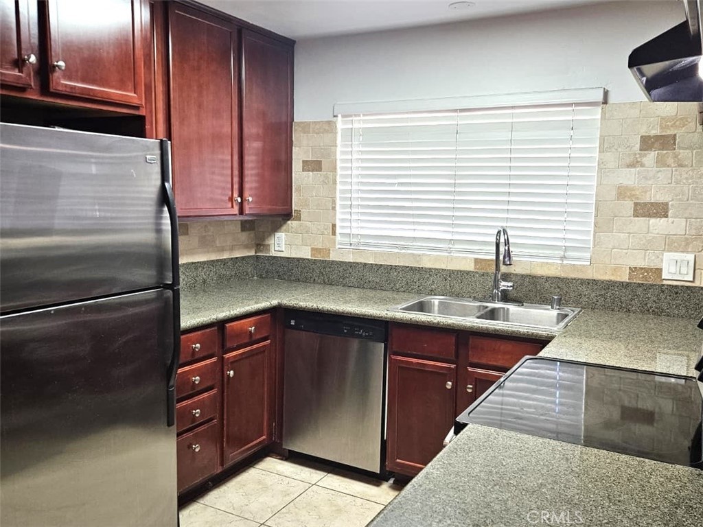 12805-18 Mapleview Street Lakeside, CA 92040 - Photo 5 of 28 a kitchen with stainless steel appliances granite countertop a sink stove and cabinets