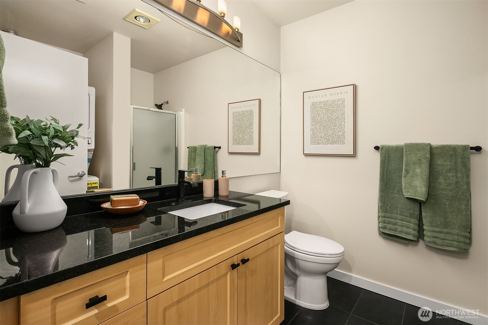 2717 Western Avenue, Unit 638 Seattle, WA 98121 - Photo 14 of 22 a bathroom with a granite countertop sink and a mirror