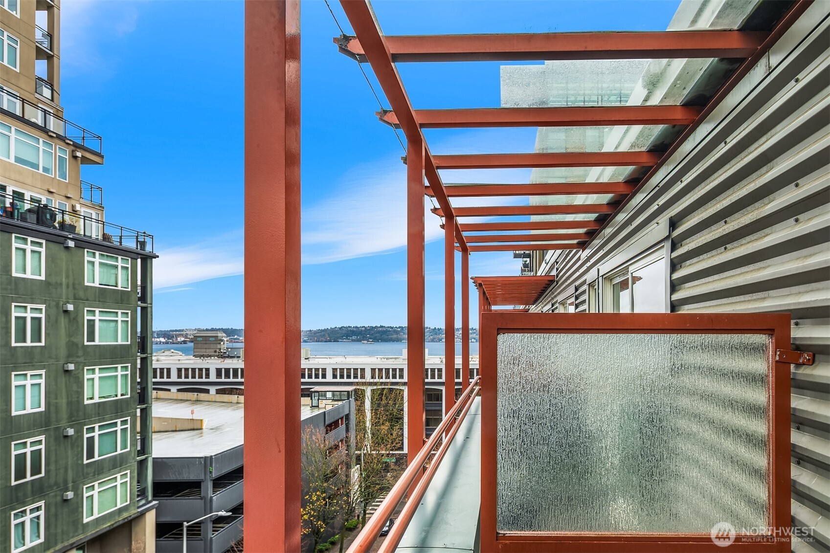 2717 Western Avenue, Unit 638 Seattle, WA 98121 - Photo 10 of 22 a view of balcony with floor to ceiling windows and wooden floor