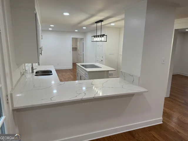 a kitchen that has a lot of cabinets in it